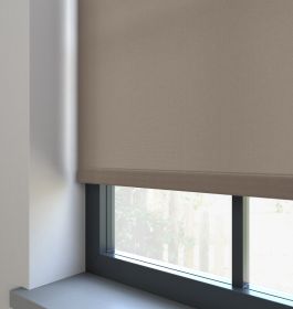 A dimout roller blind in a window