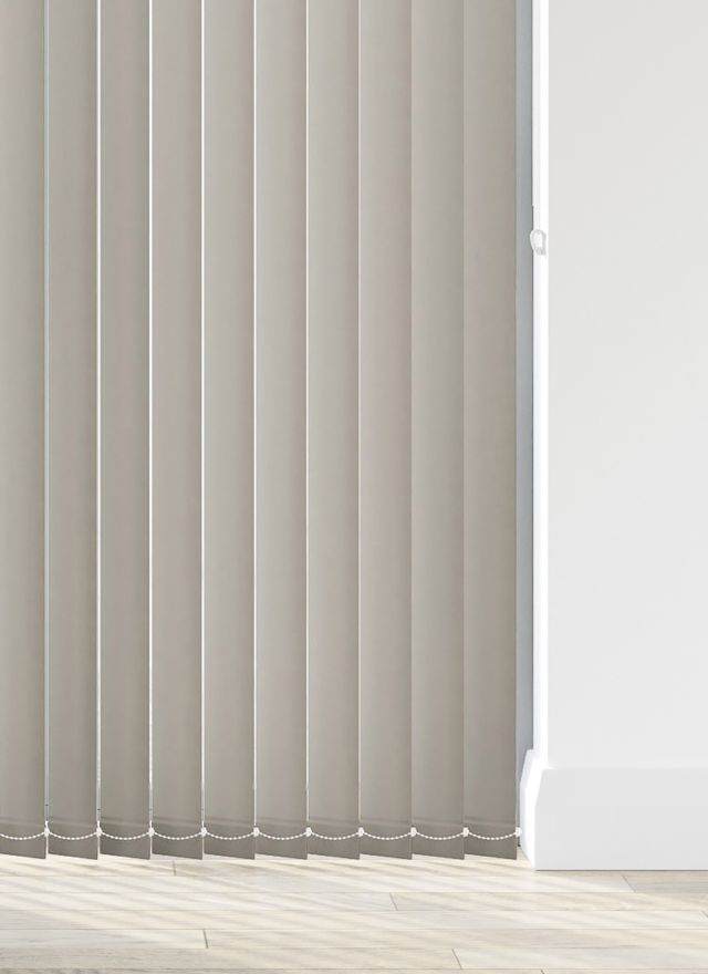A grey vertical blind in a living room