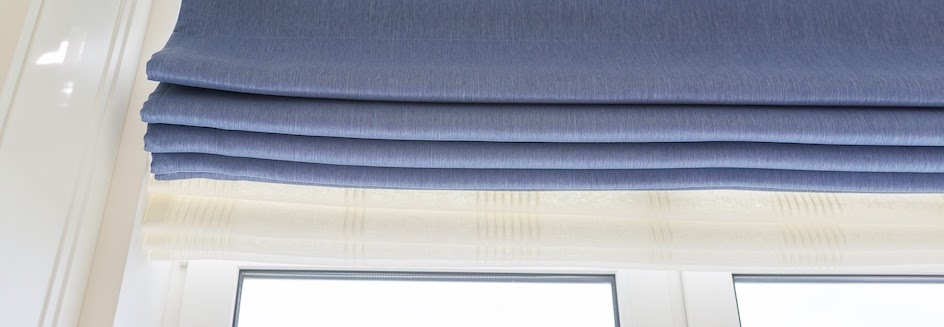 Closeup of blue wide roman blinds